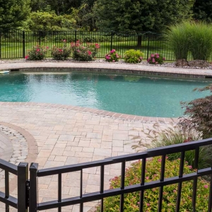 Pool surround, fence and plantings by Graf&#039;s Lawn &amp; Landscaping LLC